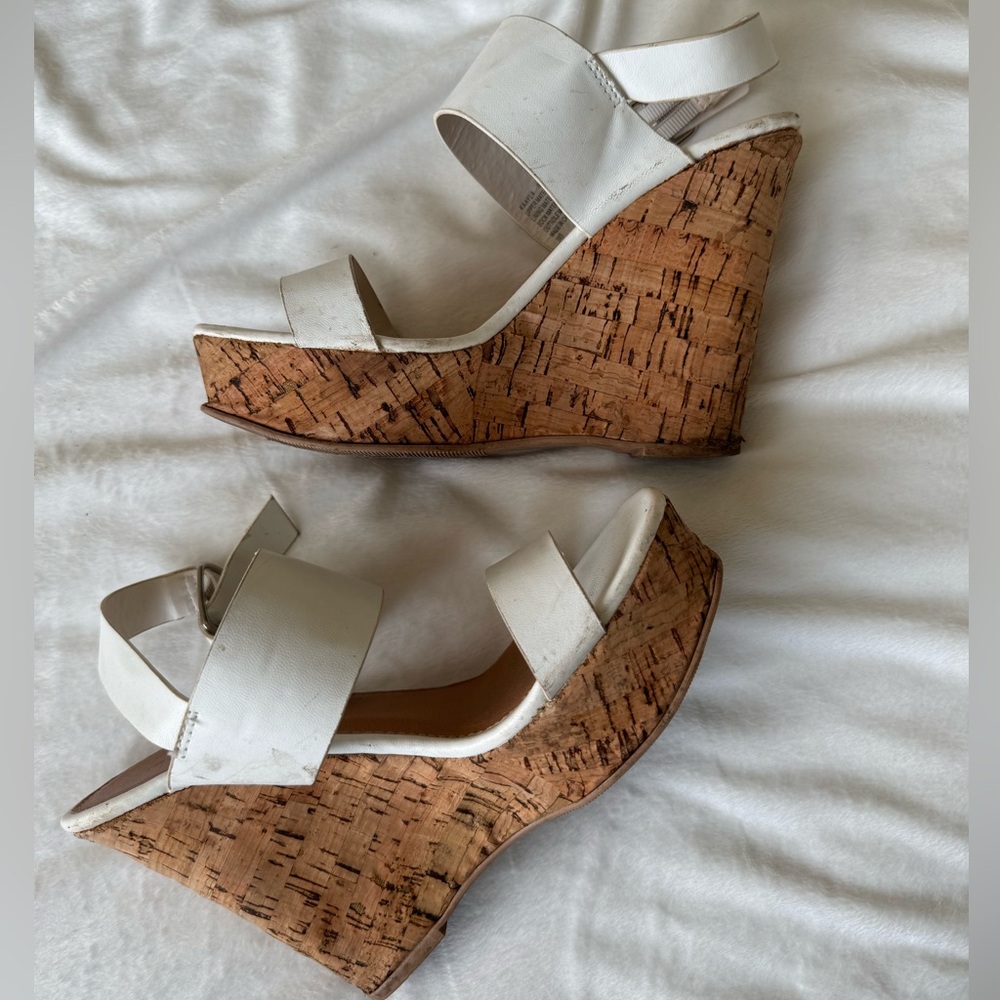 white wedge sandals with a cork platform heel